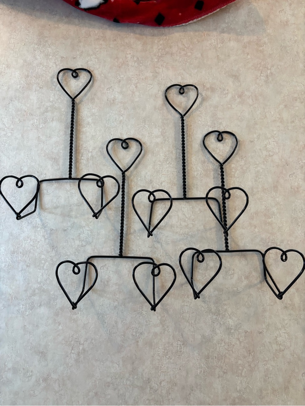 Set of 4 - black wire metal plate hangers.